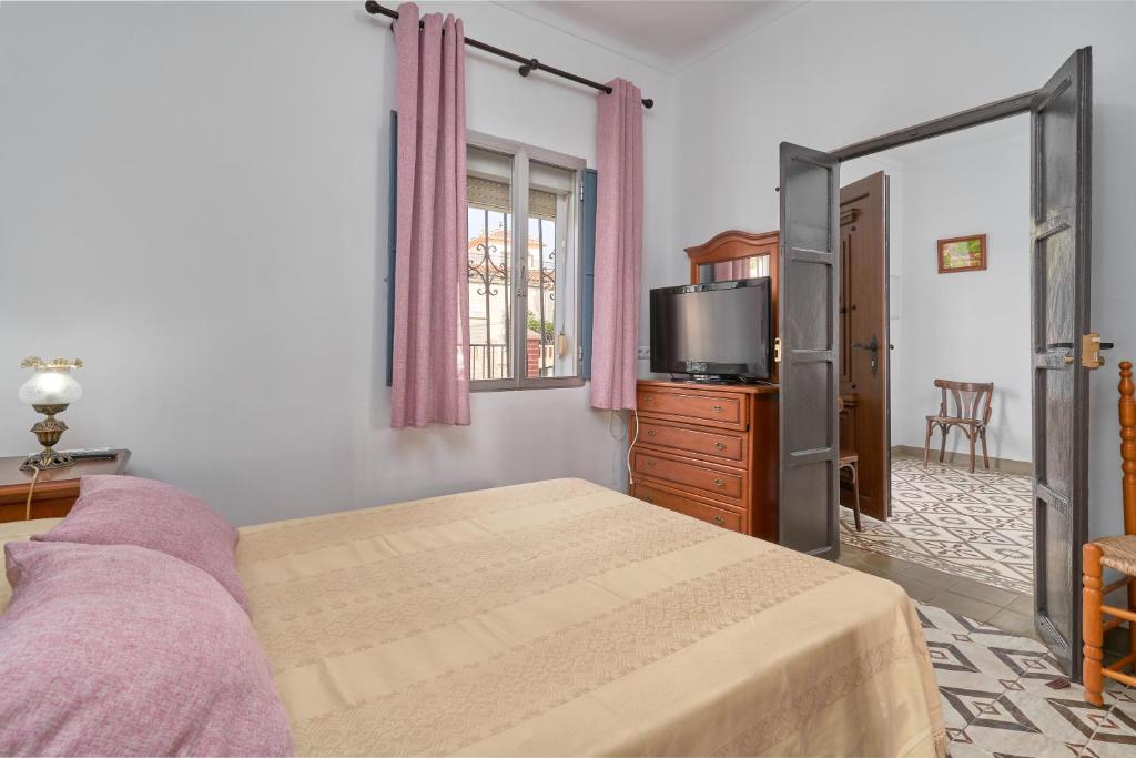 Postel nebo postele na pokoji v ubytování Casa Rafalita
