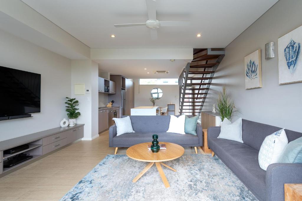 a living room with a couch and a table at Dunn Bay Apartment 5 - Dunsborough in Dunsborough