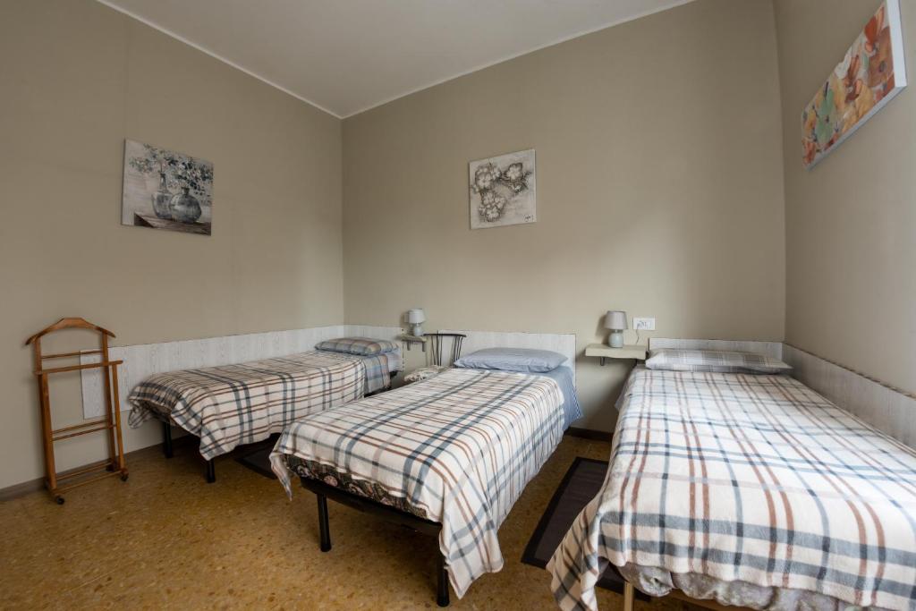 Postel nebo postele na pokoji v ubytování Dacia di Bergamo