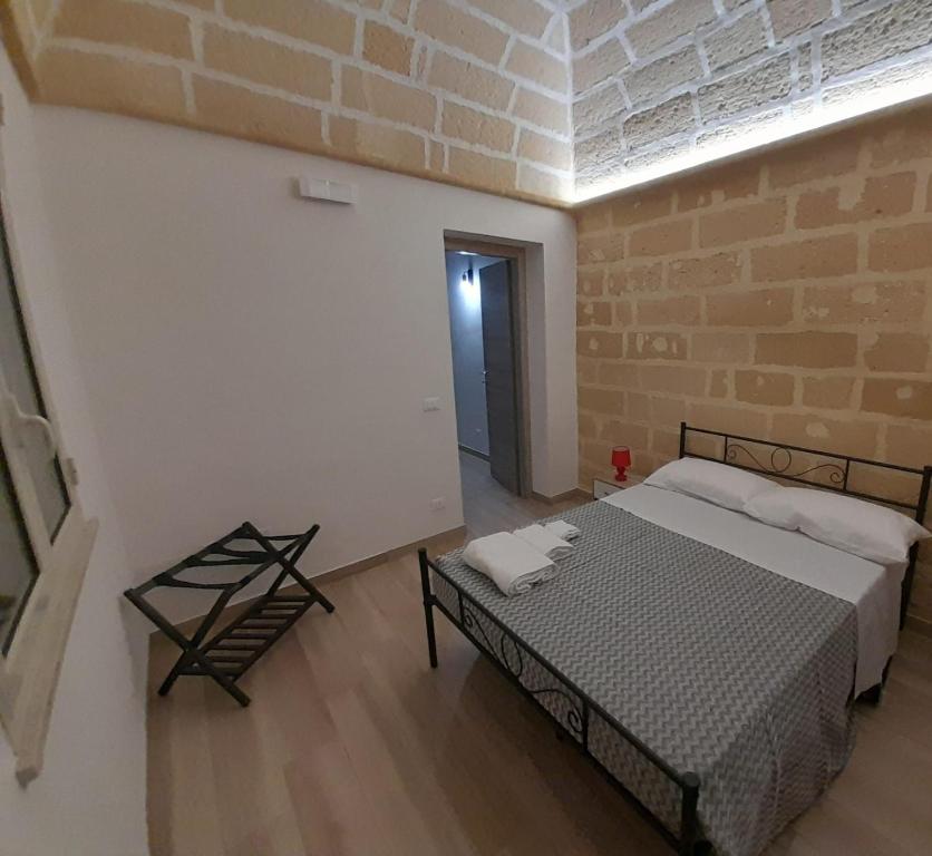 Ένα ή περισσότερα κρεβάτια σε δωμάτιο στο Case Vacanza Titone