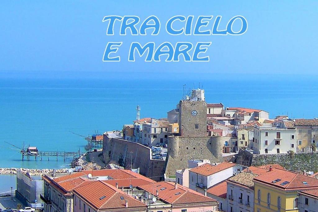 a view of a city with a clock tower at TRA CIELO E MARE vista panoramica in Termoli