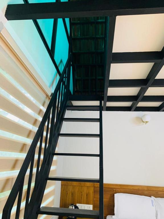 Postel nebo postele na pokoji v ubytování Regalia Wayanad