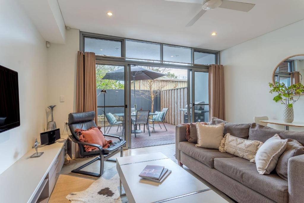 a living room with a couch and a table at Dunn Bay Apartment 3 - Dunsborough in Dunsborough