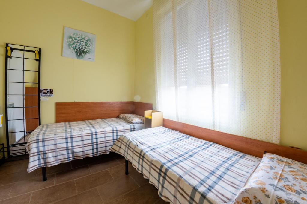 Postel nebo postele na pokoji v ubytování Dacia di Bergamo