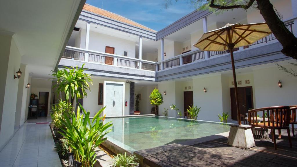 an image of a villa with a swimming pool at Teges Inn Kuta in Kuta