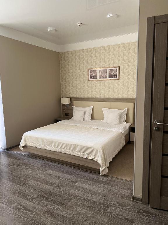 Postel nebo postele na pokoji v ubytování Elite Hotel