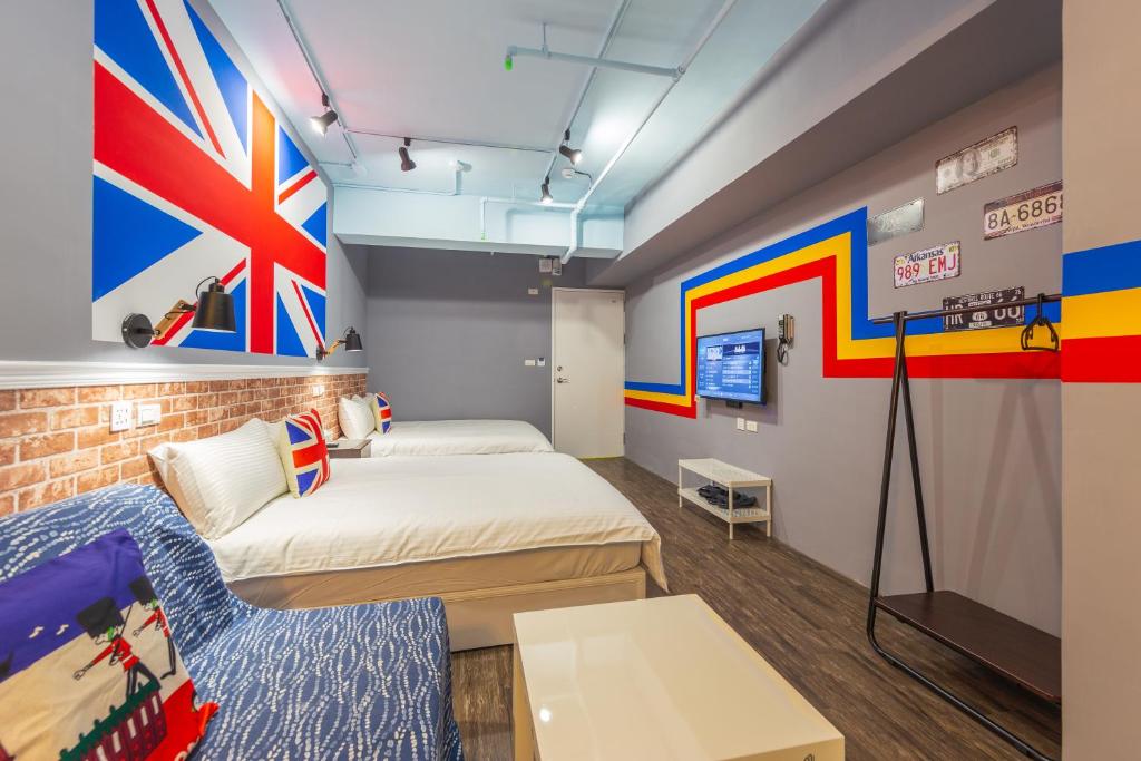 Postel nebo postele na pokoji v ubytování Kaohsiung I Hi Hotel