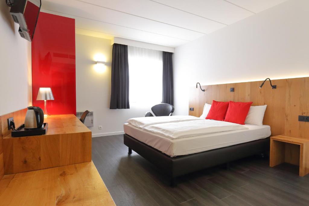 Cama o camas de una habitación en Hotel Corsendonk Viane