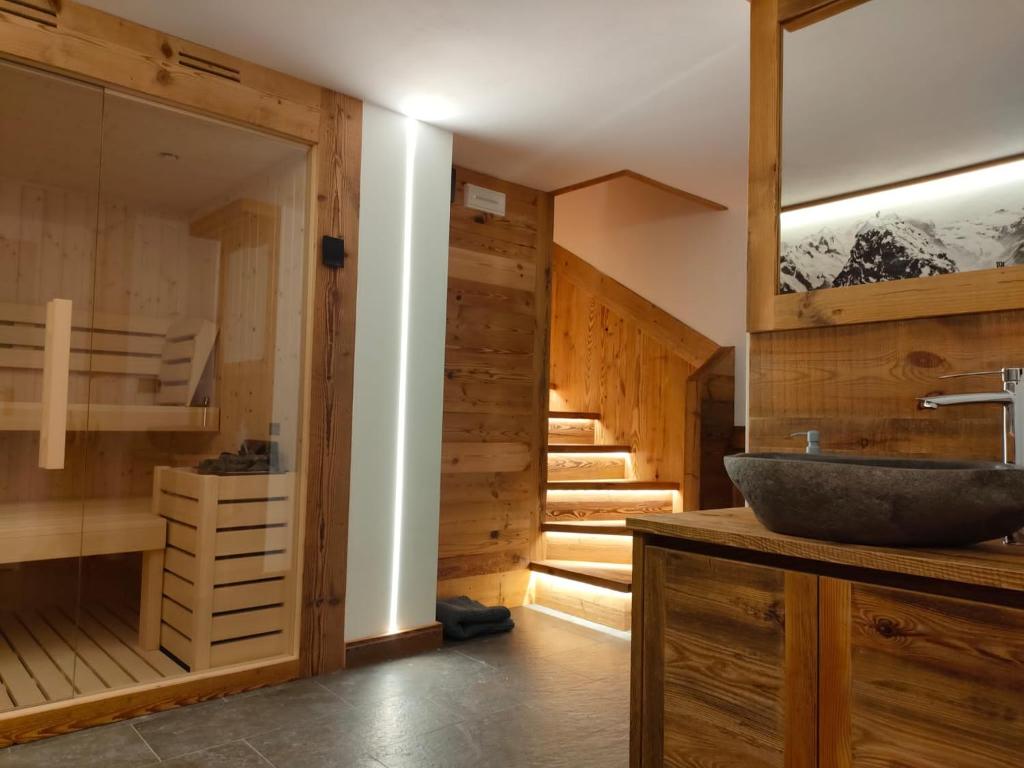 a bathroom with a sink and some stairs at Fior di Roccia Apartments in Breuil-Cervinia