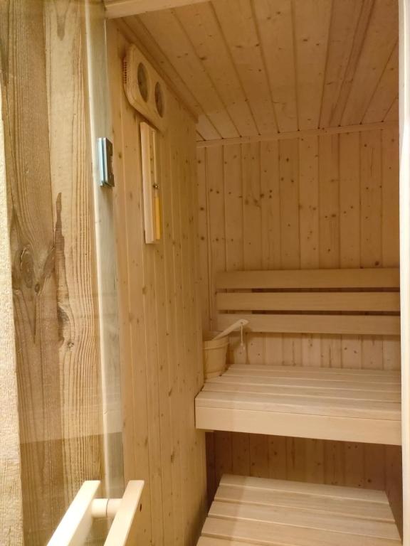 a wooden sauna with two beds in it at Fior di Roccia Apartments- in centro Cervinia, sauna privata, Matterhorn dream in Breuil-Cervinia