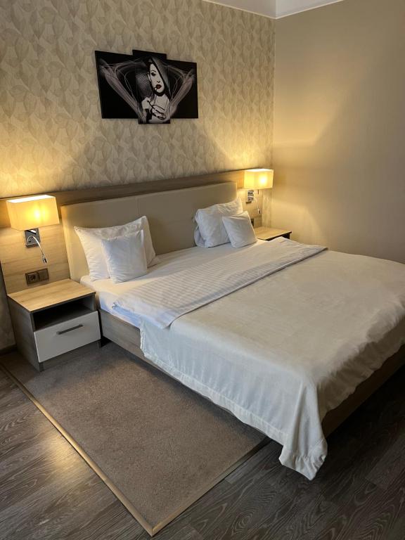 Postel nebo postele na pokoji v ubytování Elite Hotel