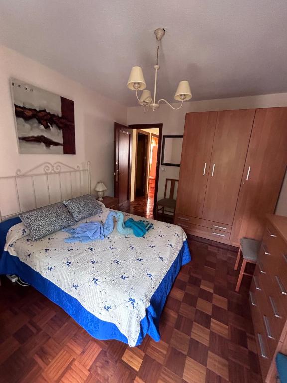 A bed or beds in a room at Apartamento Isabel
