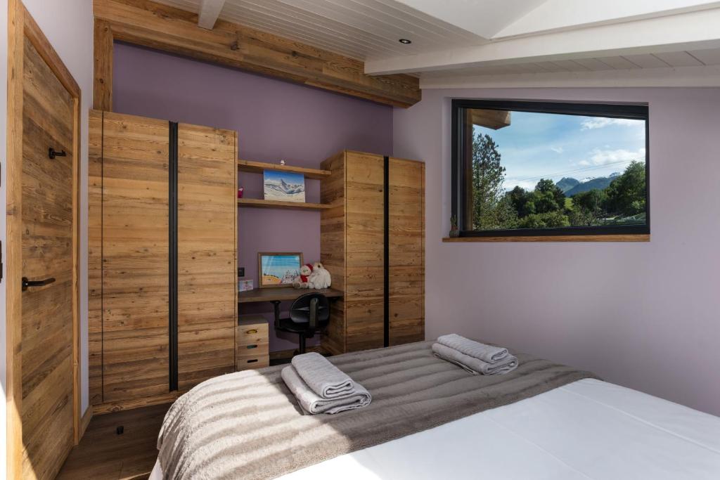 Postel nebo postele na pokoji v ubytování Chalet Aigle