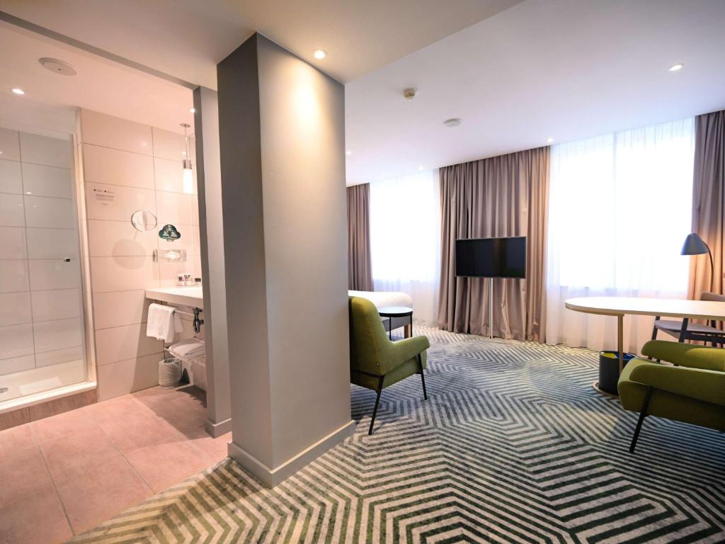 Posteľ alebo postele v izbe v ubytovaní Mercure Warszawa Grand