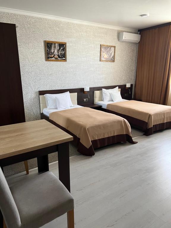 Postel nebo postele na pokoji v ubytování Elite Hotel