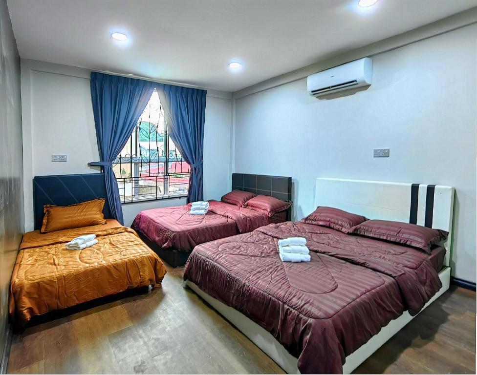 מיטה או מיטות בחדר ב-AaronL Homestay