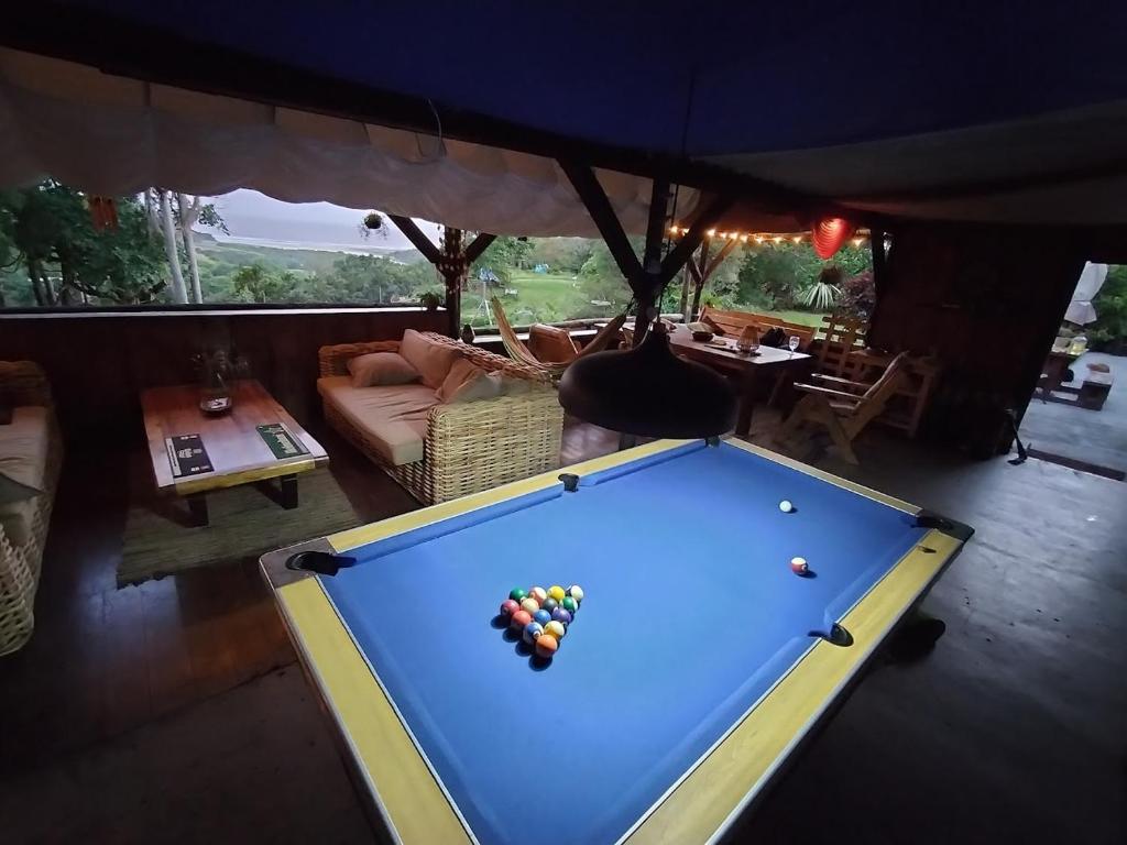 a pool table in the middle of a living room at Casa Ariel - River Lodge in Port Edward