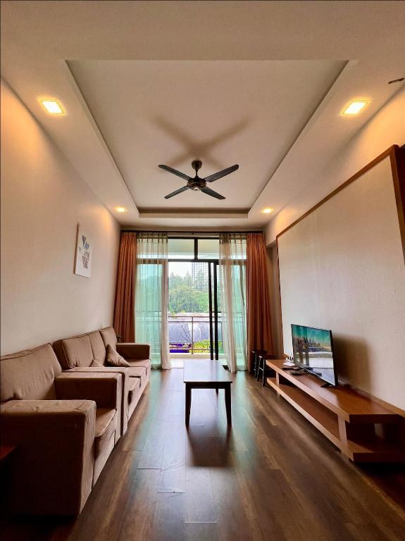 a living room with a couch and a ceiling fan at NEW 6pax 3BR Sunrise view 100m Attractive Places Kea Farm in Cameron Highlands