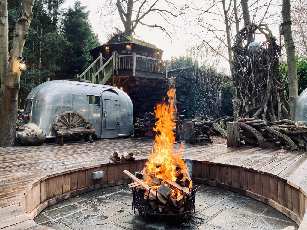 a fire pit in front of a trailer at Luxury Airstream Retreat in Tonbridge