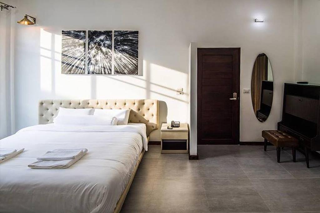 Postel nebo postele na pokoji v ubytování Na Klongluang Boutique Resort