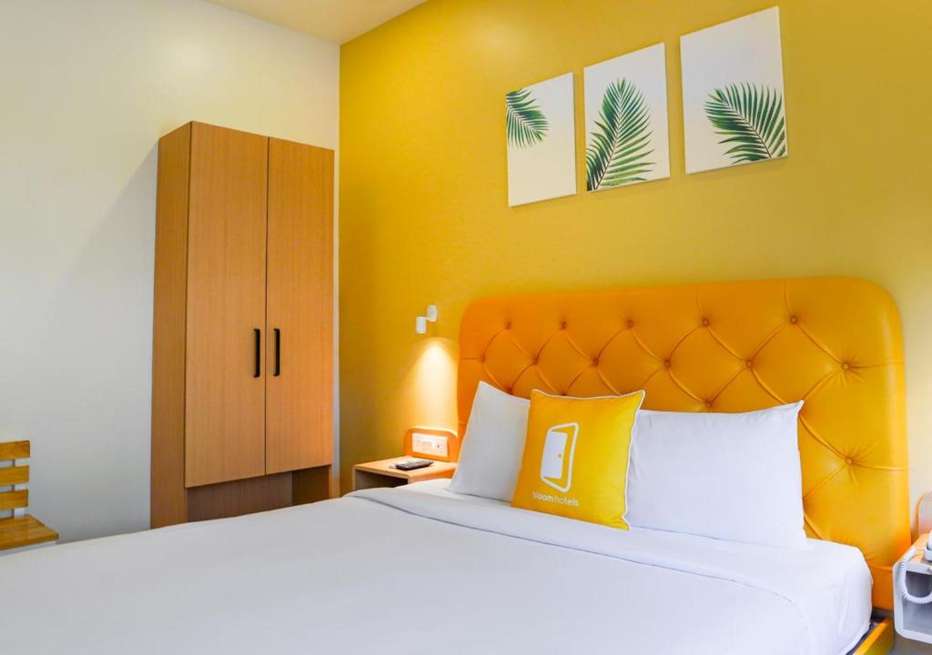 Postel nebo postele na pokoji v ubytování Bloom Hotel - Magarpatta