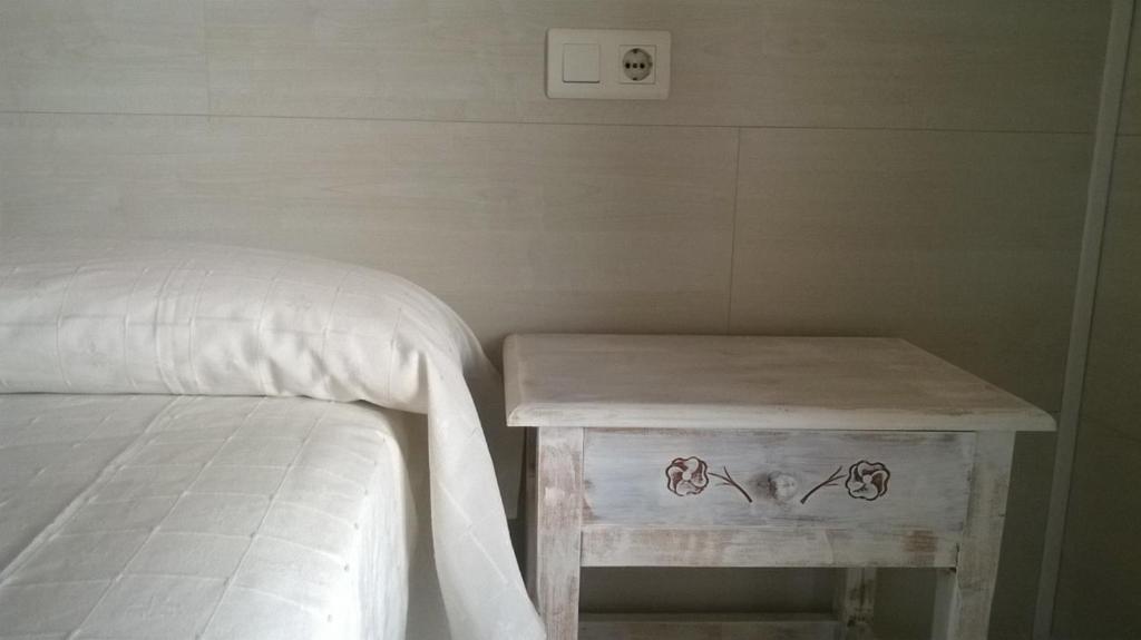 Postel nebo postele na pokoji v ubytování Hostal Paris Ciutadella