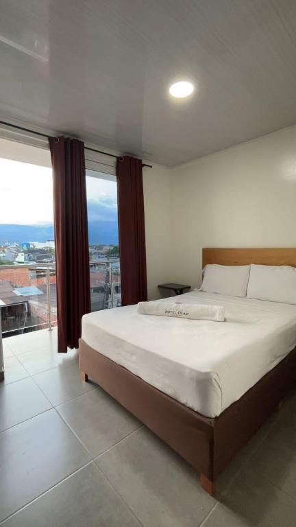 Postel nebo postele na pokoji v ubytování Hotel Olam Confort