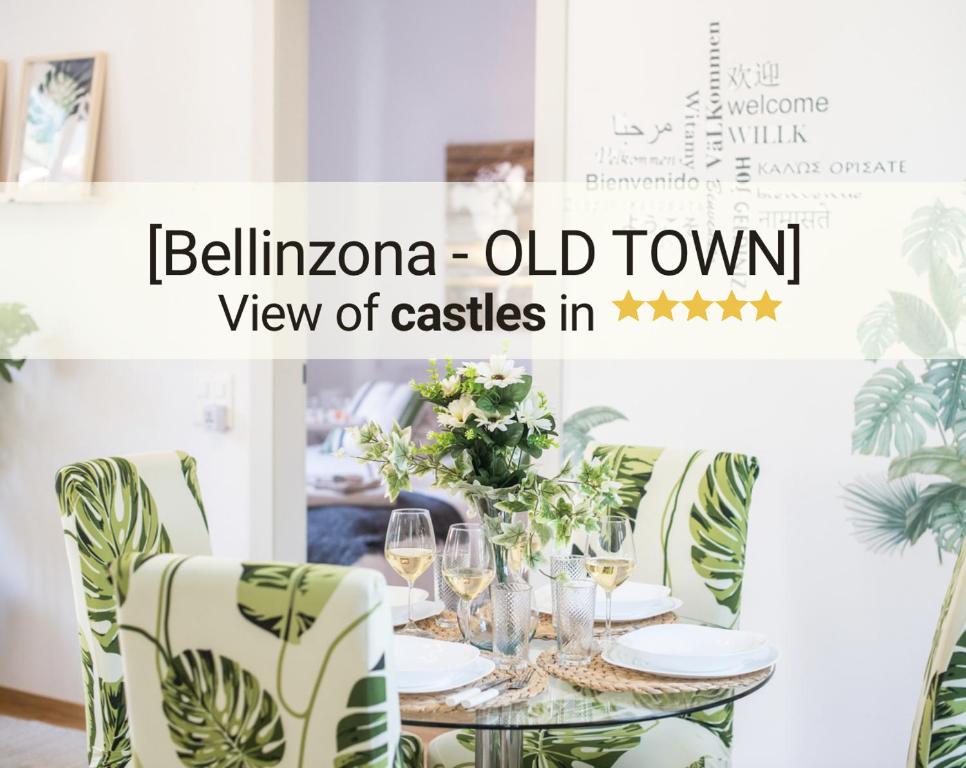 un comedor con una mesa con copas de vino en Esclusivo appartamento storico a ☆☆☆☆☆ - BELLINZONA, en Bellinzona
