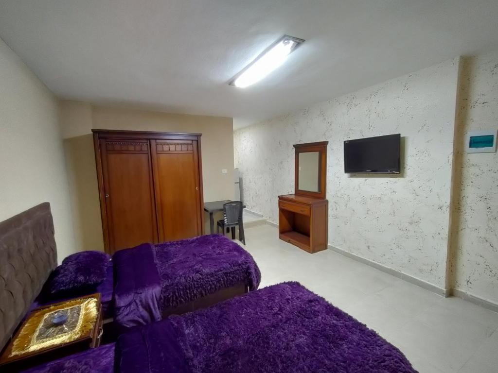 Postel nebo postele na pokoji v ubytování Sail Alhasa Tourist Resort-Tafila