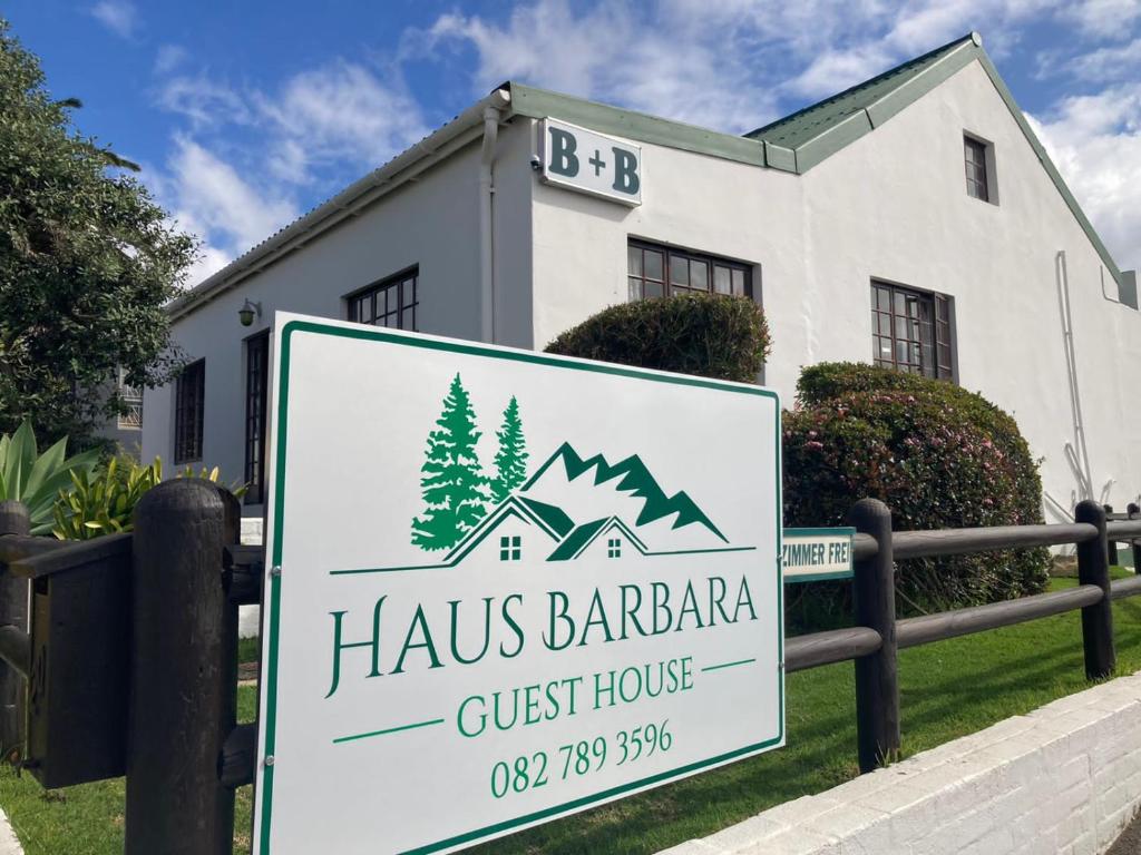 a sign in front of a guest house at Haus Barbara Guest House in Bredasdorp