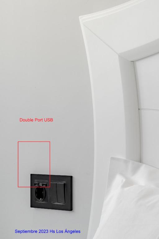 Postel nebo postele na pokoji v ubytování Hostal Los Ángeles