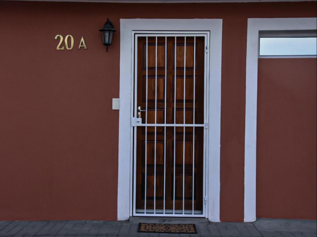 a door to a building with a sign on it at River Olive Estate Accommodation in Beaufort West