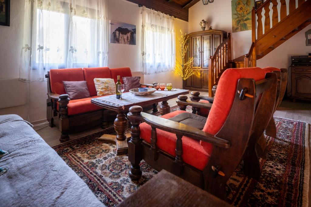 a living room with a couch and a table at Svjetlost in Jahorina