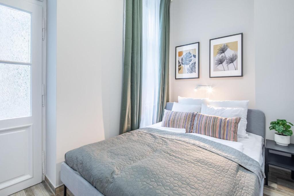 Postel nebo postele na pokoji v ubytování Central New Cozy