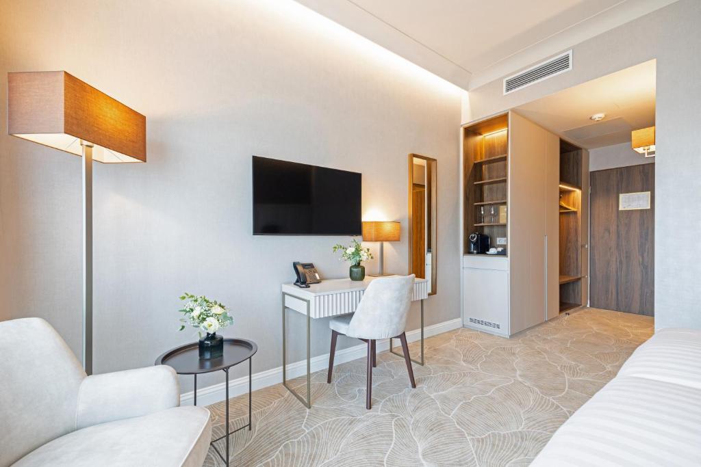 TV a/nebo společenská místnost v ubytování Hotel Gerardus