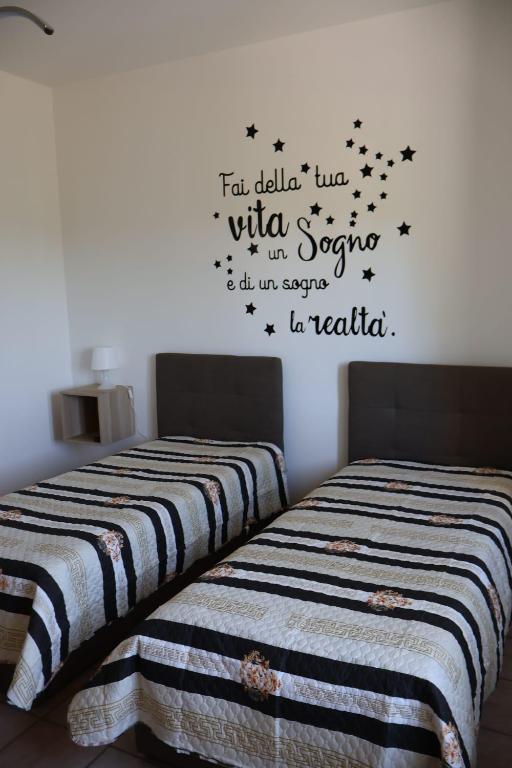 Postel nebo postele na pokoji v ubytování B&b Mamì