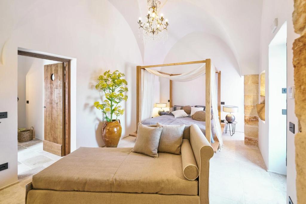 Postel nebo postele na pokoji v ubytování Bambarone La Masseria