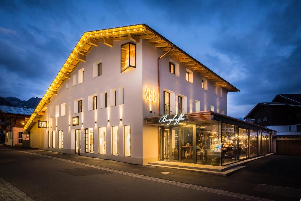 a white building with lights on the side of it at N6 Oberstdorf in Oberstdorf