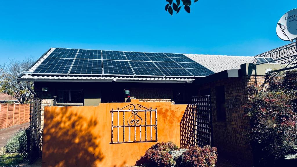 a house with solar panels on the roof at Revenir in Middelburg