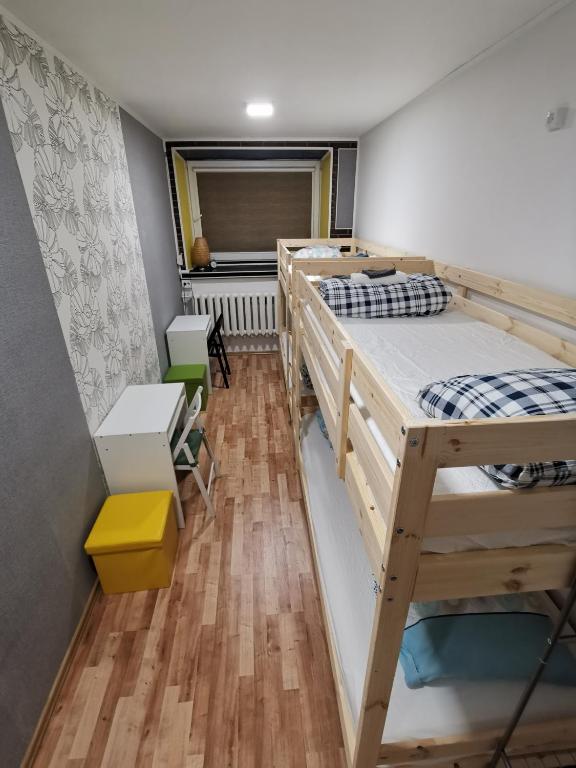 Postel nebo postele na pokoji v ubytování Tiki Taka Hostel & Pub