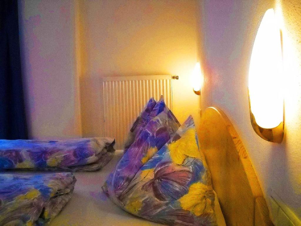 Postel nebo postele na pokoji v ubytování Gasthof Hohenbichl