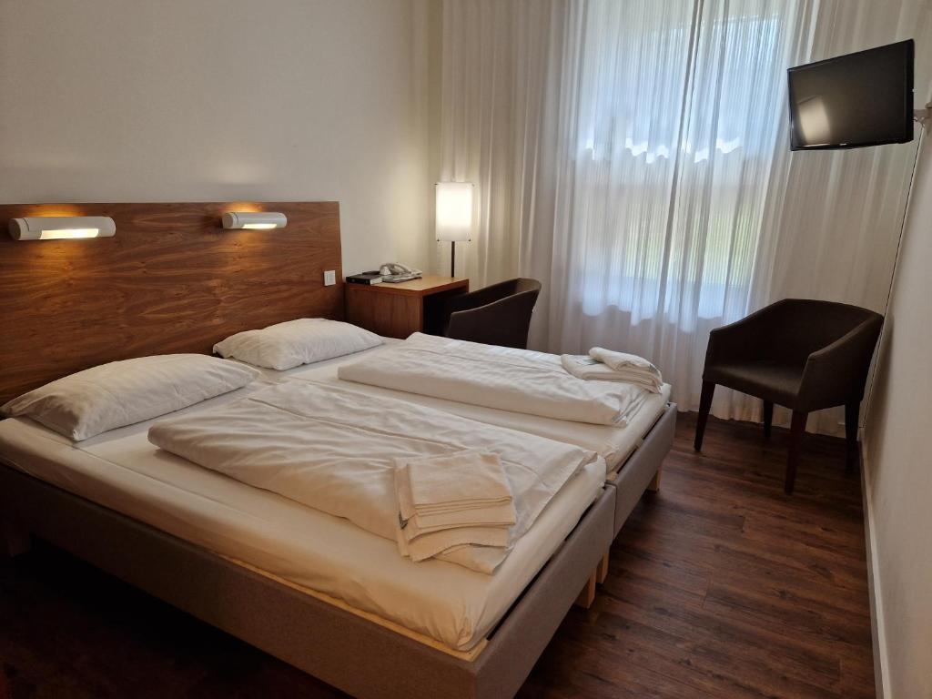 Postel nebo postele na pokoji v ubytování Kloster Drübeck
