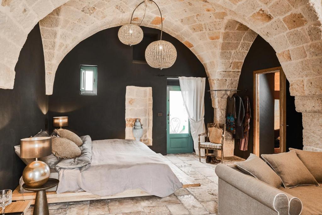 Postel nebo postele na pokoji v ubytování Bambarone La Masseria