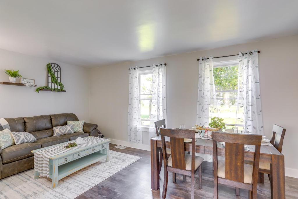 a living room with a couch and a table at Cozy Greenwich Vacation Rental with Fire Pit in Greenwich