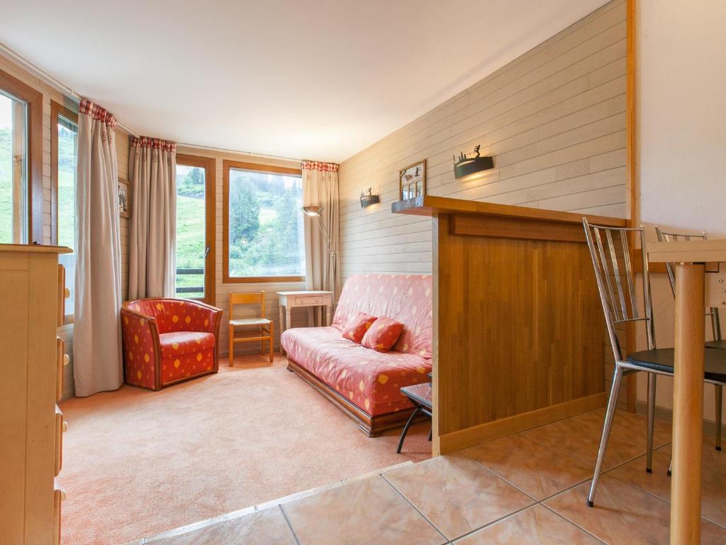 a living room with a couch and a chair at Appartement Avoriaz, 2 pièces, 5 personnes - FR-1-314-156 in Morzine