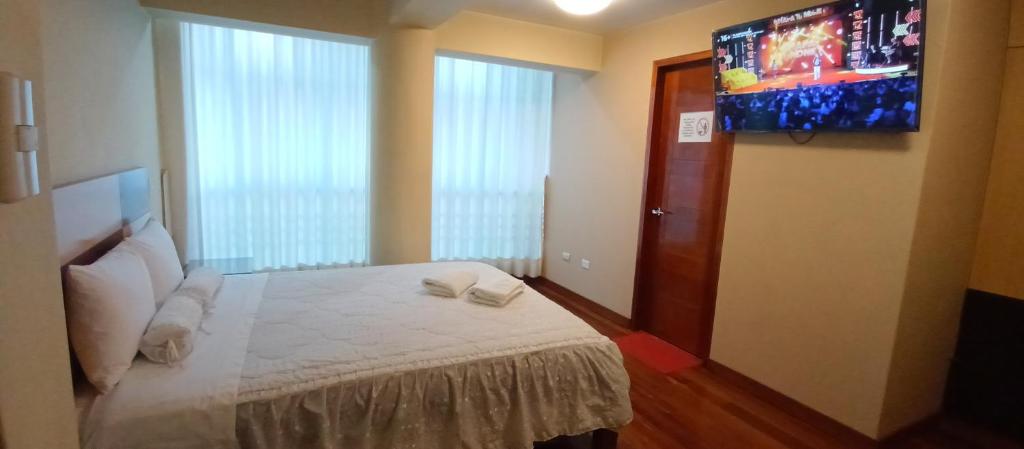Postel nebo postele na pokoji v ubytování Samkauta Hotel & Suite
