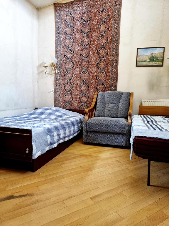 Postel nebo postele na pokoji v ubytování Polonia Tbilisi House