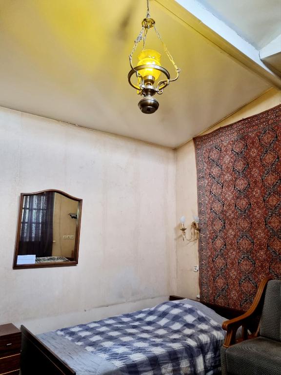 Postel nebo postele na pokoji v ubytování Polonia Tbilisi House