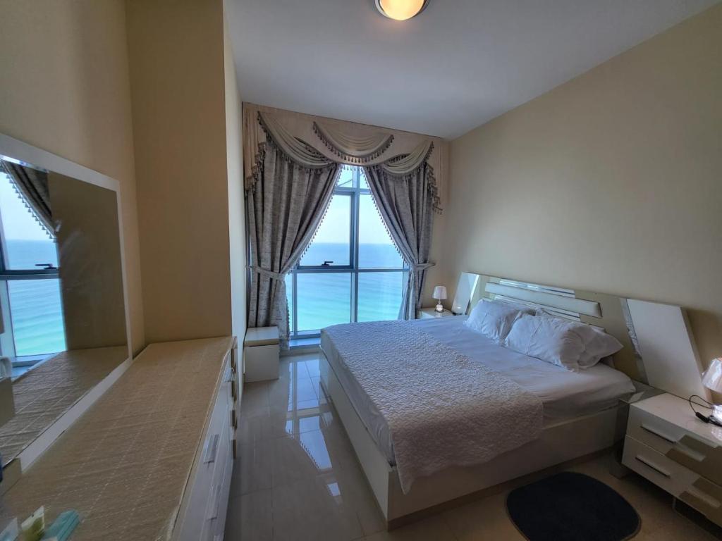 Postel nebo postele na pokoji v ubytování Beachfront Holiday Homes