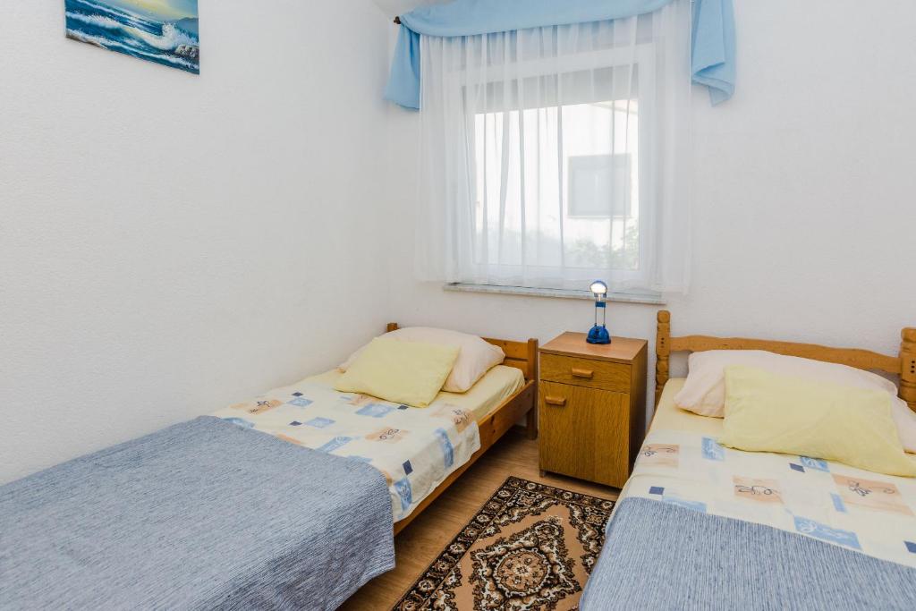 Posteľ alebo postele v izbe v ubytovaní Apartments Vinceljak